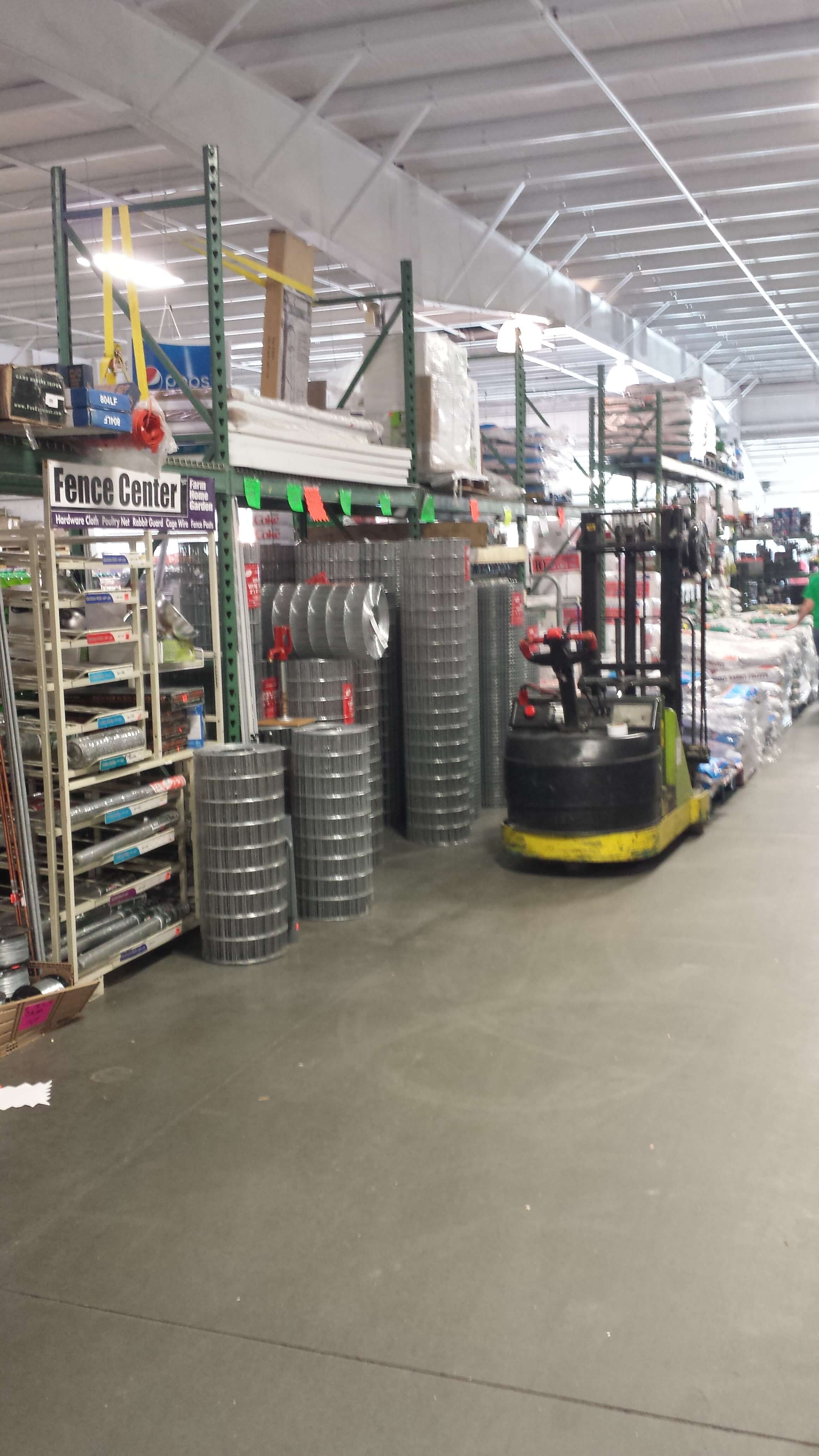 Image of the farm supply Aisle inside Bargain Foods Store in Pelzer SC