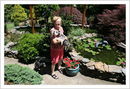 My frugal German mother standing in front of her water-garden